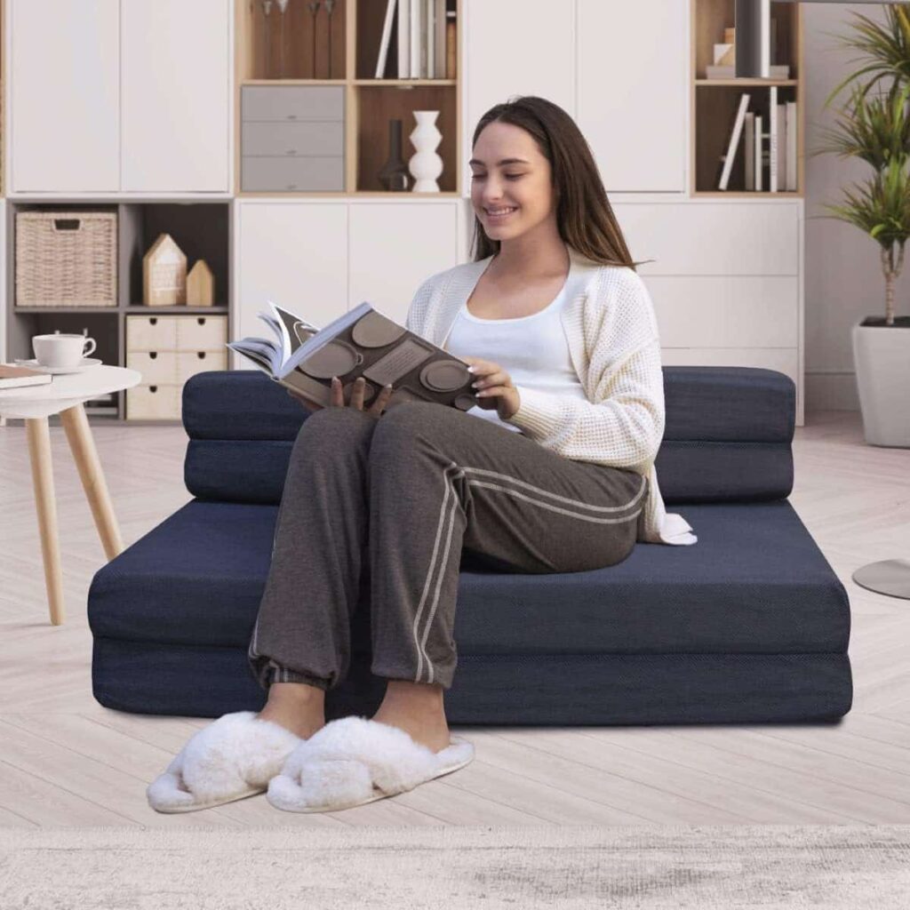 Milliard trifold mattress sofa shown folded as a seat and flat as a bed